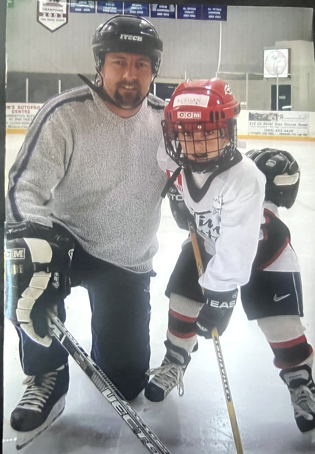 David with his son at the hockey rink